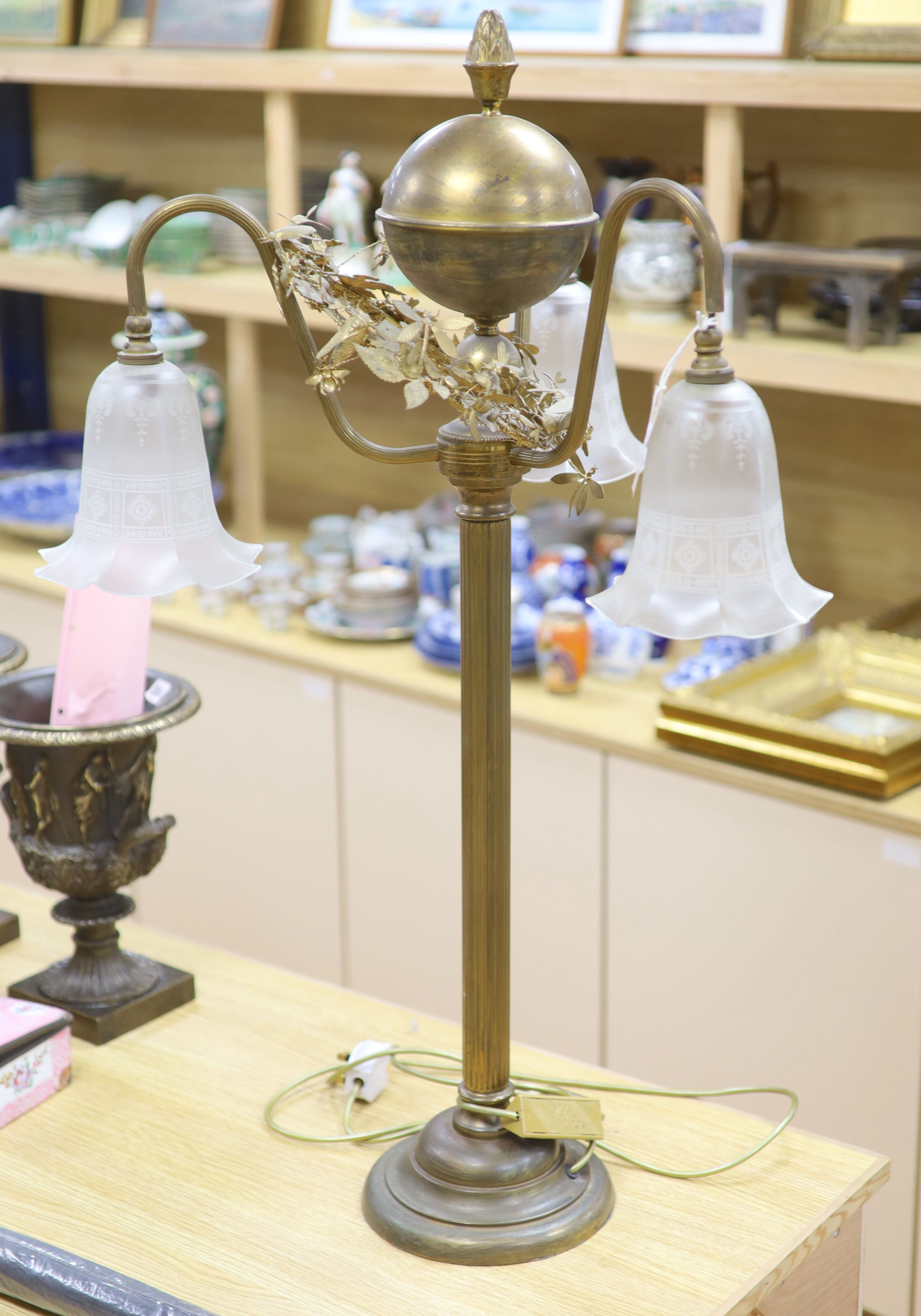 A gilt metal three branch lamp, height 92cm.